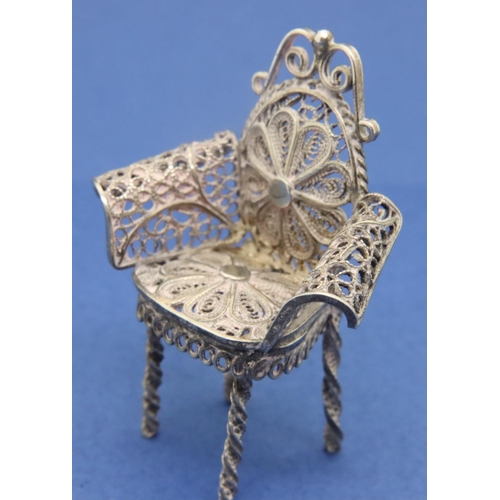 120 - Silver filigree miniature table and three chairs dolls house furniture. P&P Group 1 (£14+VAT for the... 