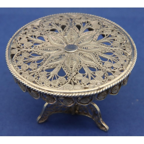 120 - Silver filigree miniature table and three chairs dolls house furniture. P&P Group 1 (£14+VAT for the... 