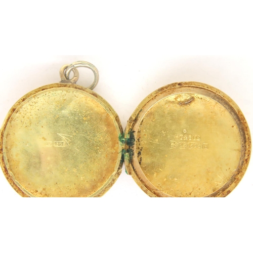 44 - A 15ct gold circular locket, Chester assay, D: 20 mm, 4.2g. Dents throughout. P&P Group 1 (£14+VAT f... 