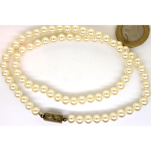 73 - Cultured pearl necklace with a silver clasp. P&P Group 1 (£14+VAT for the first lot and £1+VAT for s... 