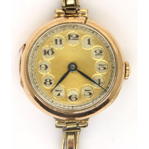 91 - 9ct gold cased early 20th century wristwatch with gilt dial and Arabic chapters on rolled gold expan... 