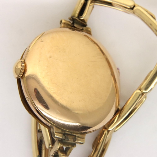 91 - 9ct gold cased early 20th century wristwatch with gilt dial and Arabic chapters on rolled gold expan... 