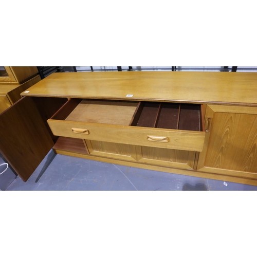 603 - G Plan; a mid 20th century teak sideboard comprising cupboards and single drawer, 186 x 45 x 72 cm H... 