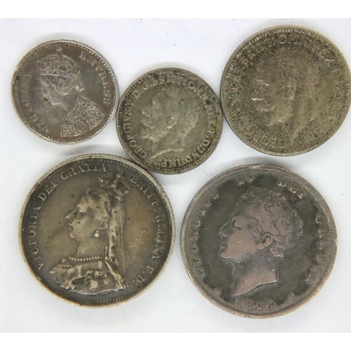 3069 - 1826 shilling of George IV, 1887 shilling of Queen Victoria, 1877 two Annas (India) and two coins of... 