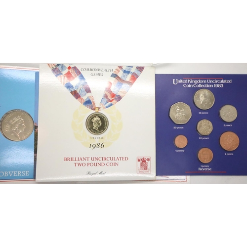 3091 - 1985 and 1986 Royal Mint two pounds commemorative coins in sleeves and a 1983 Royal Mint uncirculate... 