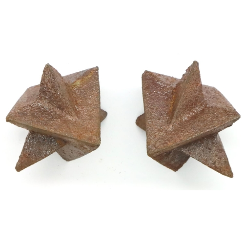 2053 - Two WWII SOE OSS caltrops. P&P Group 1 (£14+VAT for the first lot and £1+VAT for subsequent lots)