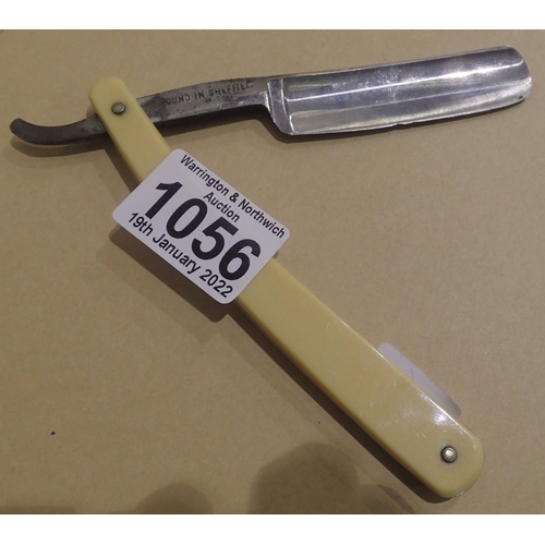 1056 - Antique silver steel cut throat razor with ivorine cover. P&P Group 1 (£14+VAT for the first lot and... 