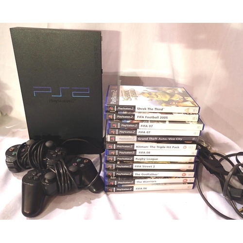 2207 - Playstation 2 console, x2 control pads, leads etc, and twelve games. P&P Group 3 (£25+VAT for the fi... 