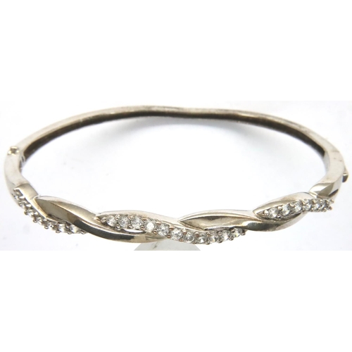 59 - 925 silver stone set hinged bangle, D: 55 mm, 9g, misshapen. P&P Group 1 (£14+VAT for the first lot ... 