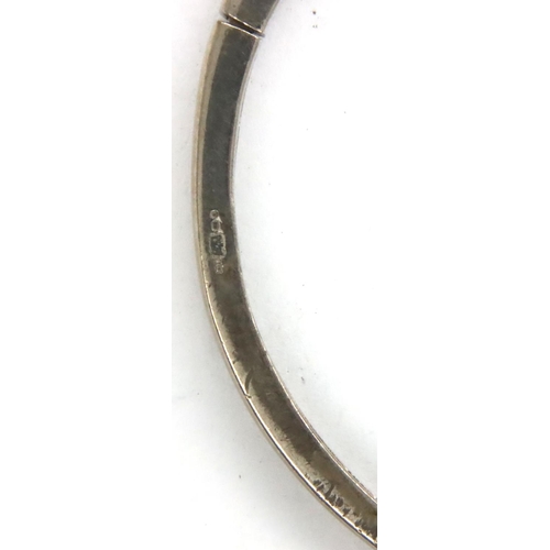 59 - 925 silver stone set hinged bangle, D: 55 mm, 9g, misshapen. P&P Group 1 (£14+VAT for the first lot ... 