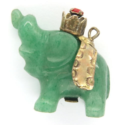 67 - Carved jade type elephant pendant with a 14ct gold stone set band, L: 19 mm, 4.3g. P&P Group 1 (£14+... 