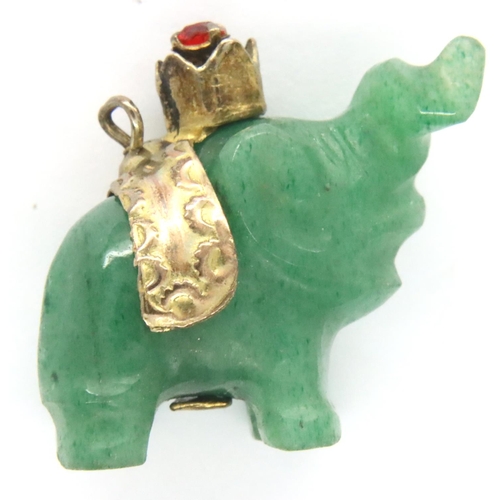 67 - Carved jade type elephant pendant with a 14ct gold stone set band, L: 19 mm, 4.3g. P&P Group 1 (£14+... 