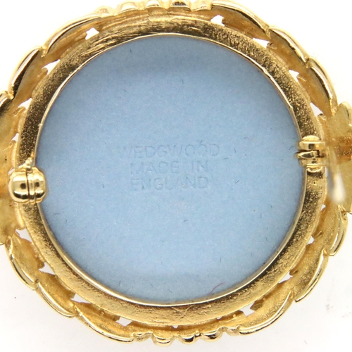 76 - Wedgwood boxed blue and white cameo brooch, D: 35 mm. P&P Group 1 (£14+VAT for the first lot and £1+... 