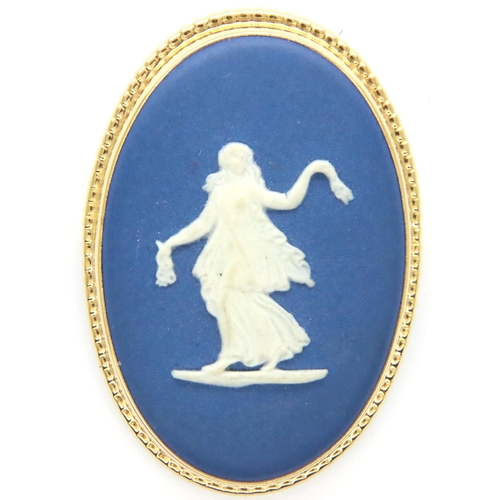 78 - Wedgwood boxed dark blue and white cameo brooch, D: 40 mm. P&P Group 1 (£14+VAT for the first lot an... 