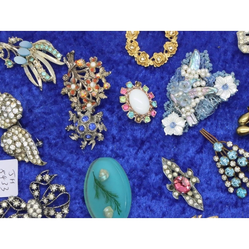 83 - Collection of thirty four assorted brooches, mounted to board. P&P Group 2 (£18+VAT for the first lo... 