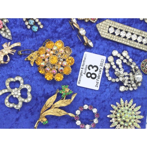 83 - Collection of thirty four assorted brooches, mounted to board. P&P Group 2 (£18+VAT for the first lo... 