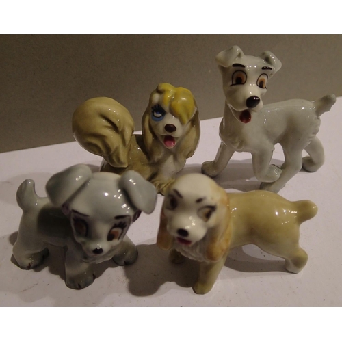 1107 - Four small Wade dog figurines to include Lady and the Tramp. P&P Group 1 (£14+VAT for the first lot ... 