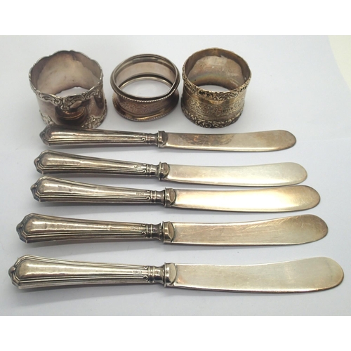 105 - Three silver napkin rings and five silver handled butter knives (7). P&P Group 2 (£18+VAT for the fi... 