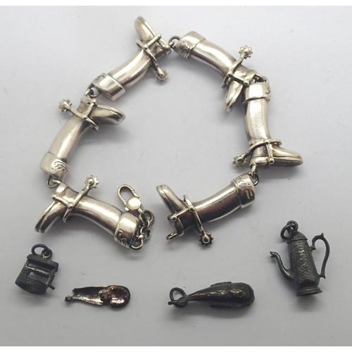 107 - Gucci silver bracelet in the form of riding boots and three further charms, L: 20 cm. P&P Group 1 (£... 