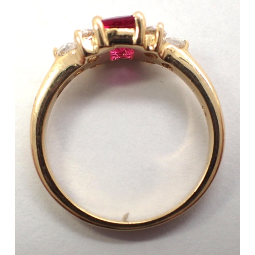 11 - 9ct gold ring set with a single central ruby and clear stone set shoulders, size J/K, 2.1g. P&P Grou... 