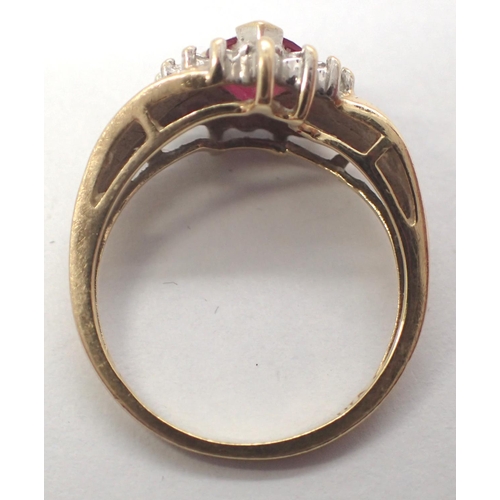 29 - 9ct gold ring set with a heart shaped central ruby and diamond shoulders, size M, 2.5g. P&P Group 1 ... 