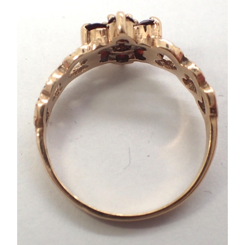 30 - 9ct gold garnet set daisy ring, size N, 2.1g. P&P Group 1 (£14+VAT for the first lot and £1+VAT for ... 