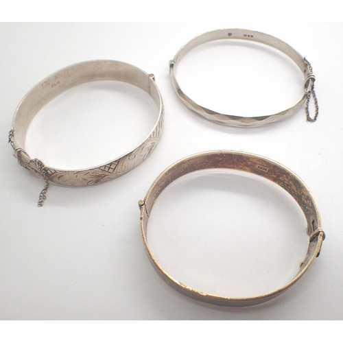 61 - Three hallmarked silver bangles, combined 89g. P&P Group 1 (£14+VAT for the first lot and £1+VAT for... 