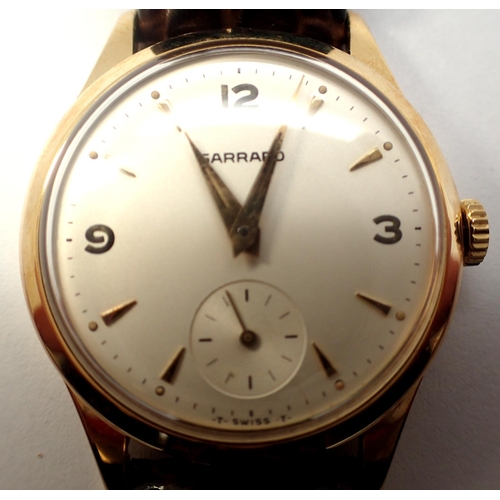 67 - Garrard; 9ct gold gents dress wristwatch with champagne dial, seconds subsidiary dial on leather str... 