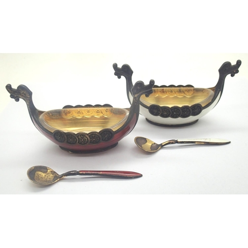 93 - Pair of Norwegian red and white enamelled 925 silver gilt salts with glass liners and spoons, no los... 