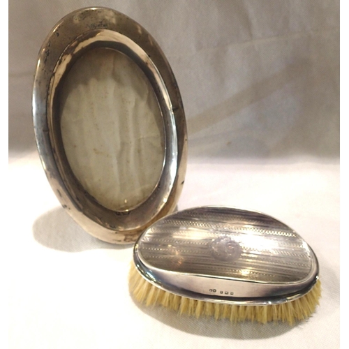 97 - Hallmarked silver oval photograph frame and brush, frame L: 18 cm. P&P Group 1 (£14+VAT for the firs... 