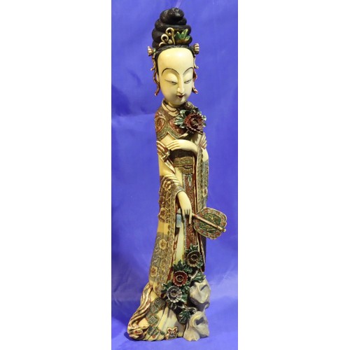 376 - Tall polychrome ivory female figurine holding fan with character mark to base, H: 530 mm, split to f... 