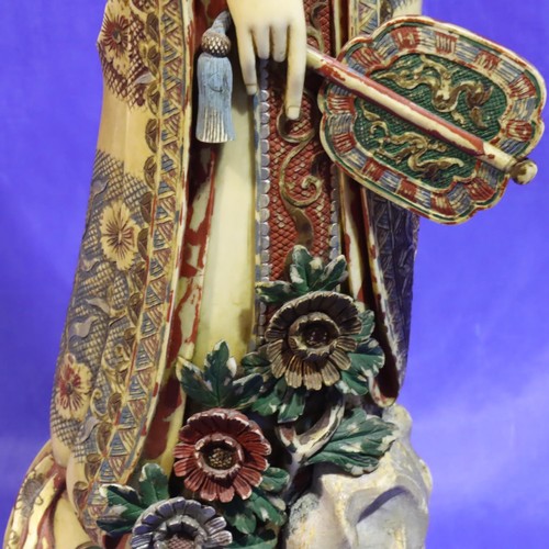 376 - Tall polychrome ivory female figurine holding fan with character mark to base, H: 530 mm, split to f... 