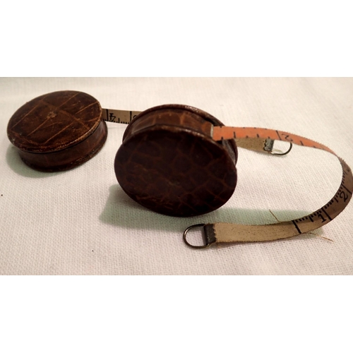 1084 - Two vintage miniature leather covered dressmakers tape measures. P&P Group 1 (£14+VAT for the first ... 