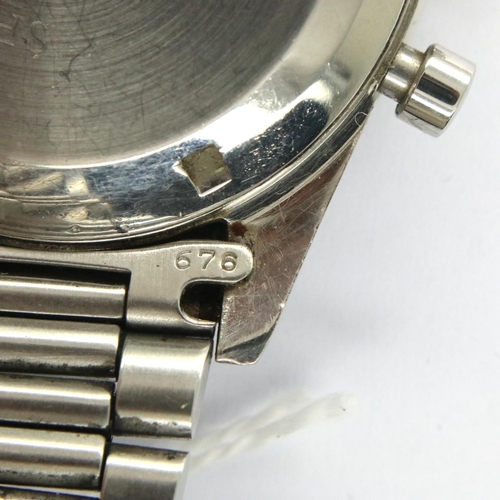 64 - Omega Speedmaster; 1963 model on Omega steel bracelet, black dial, working at lotting. Inner case nu... 