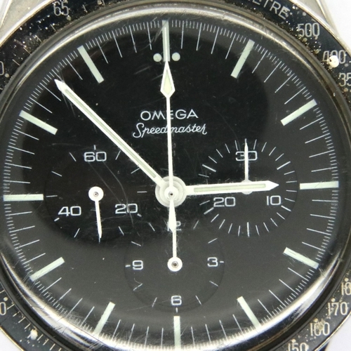 64 - Omega Speedmaster; 1963 model on Omega steel bracelet, black dial, working at lotting. Inner case nu... 