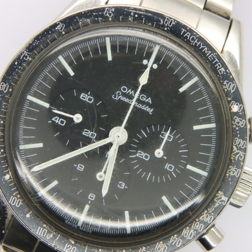 64 - Omega Speedmaster; 1963 model on Omega steel bracelet, black dial, working at lotting. Inner case nu... 