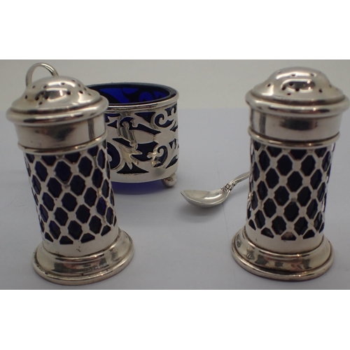 102A - Hallmarked silver salt and two pepperettes with blue glass liners. Not available for in-house P&P, c... 