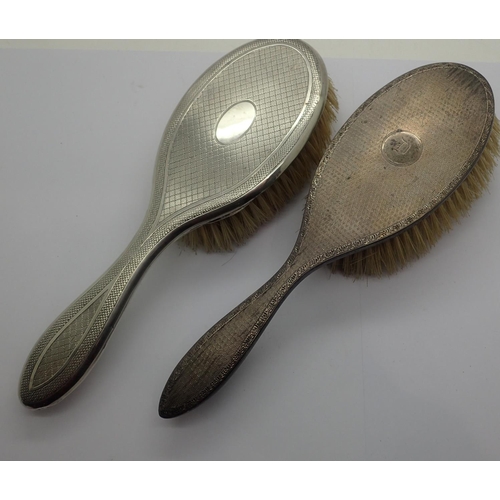 104A - Two hallmarked silver hairbrushes and two hallmarked silver mirrors. Not available for in-house P&P,... 