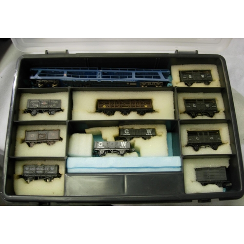 2092 - N gauge; eleven wagons including a car transporter, mostly in very good condition, in storage box. P... 