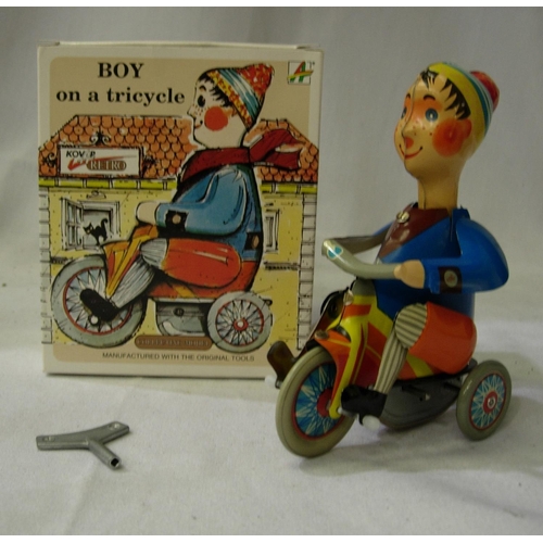 2148 - Kovap tinplate clockwork boy on a tricycle, pedals and rods head. Excellent condition with key/boxed... 