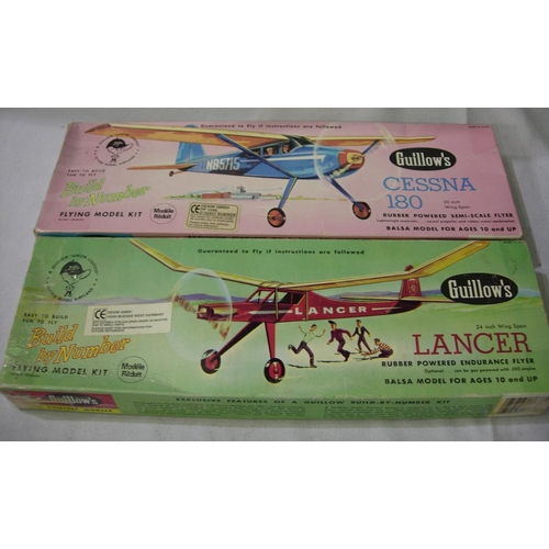 2158 - Two Guillows Balsa/Tissue rubber powered flying model aircraft kits. Cessna 180-20 inch wingspan, La... 