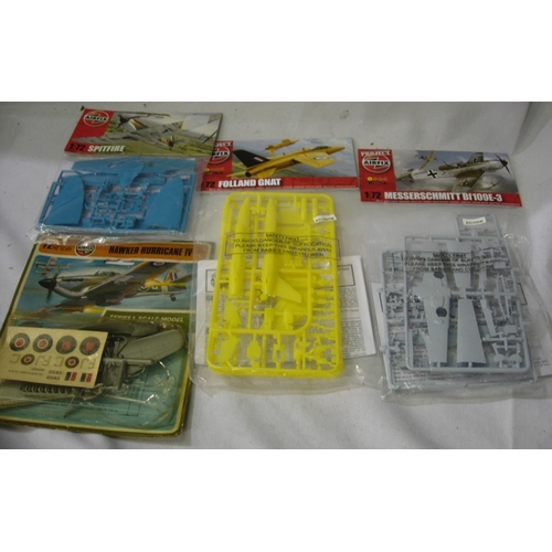 2163 - Four Airfix 1/72 scale aircraft kits Hurricane, Spitfire, Messerschmitt 109 and Folland Gnat (red ar... 