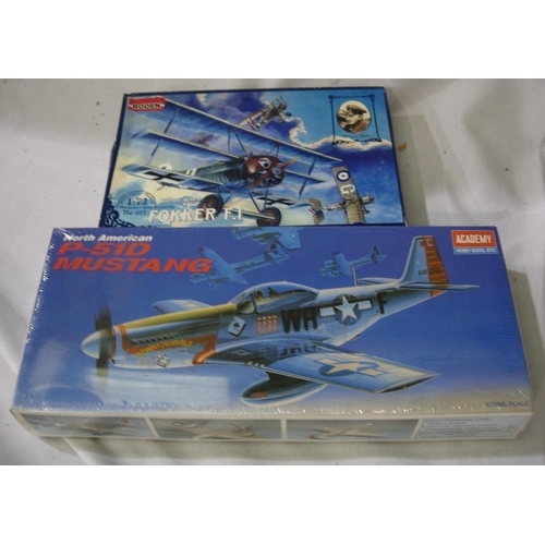 2169 - Two 1/72 scale plastic aircraft kits, Roden Fokker F1 and Academy P51 Mustang (sealed), also empty b... 