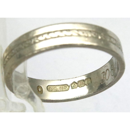 12 - Presumed platinum band ring, size N, 5.0g. P&P Group 1 (£14+VAT for the first lot and £1+VAT for sub... 