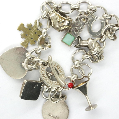 60 - 925 silver Links of London charm bracelet with nine charms to include a cocktail glass, L: 12 cm, la... 