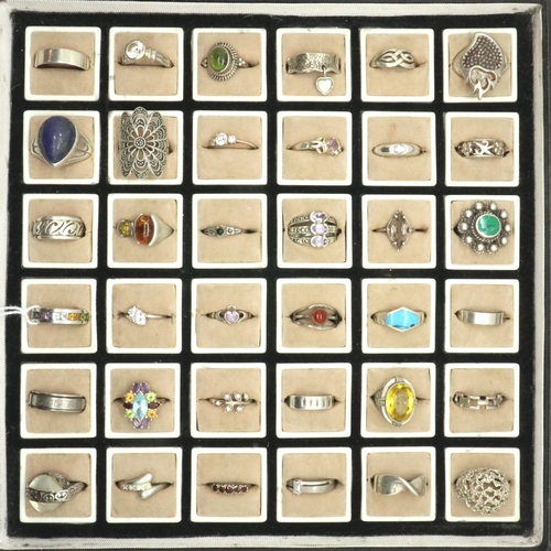 62 - Thirty six 925 silver rings of varying designs and sizes to include stone set examples. P&P Group 1 ... 