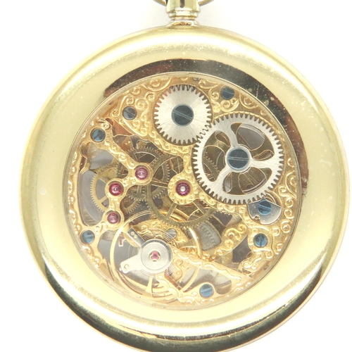 67 - Modern gold plated skeleton pocket watch with chain on a wooden stand. P&P Group 1 (£14+VAT for the ... 