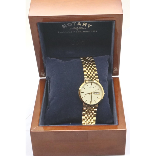 73 - Rotary; quartz day date gold plated wristwatch in a wooden case, requires battery. P&P Group 1 (£14+... 