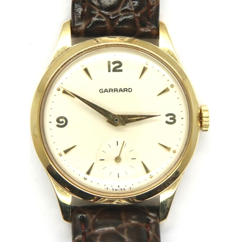 75 - Garrard; 9ct gold gents dress wristwatch with champagne dial and subsidiary seconds dial on leather ... 