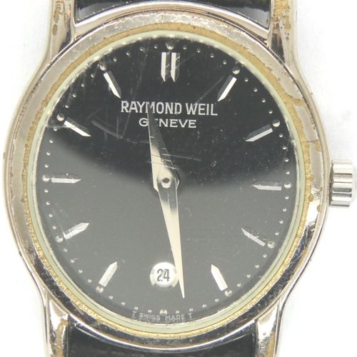 82 - Raymond Weil; ladies steel cased wristwatch with date aperture on a black leather strap, requires ba... 